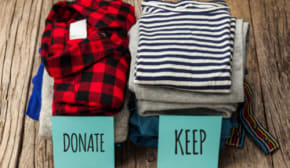 donate pile and keep pile of clothes