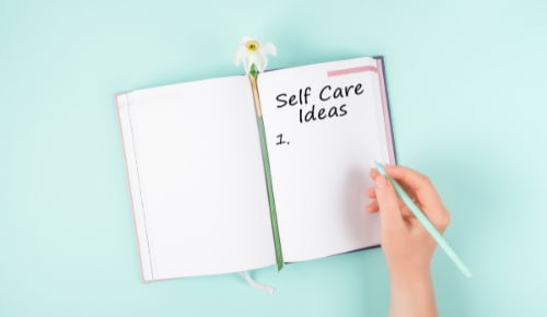 notebook labelled self care ideas